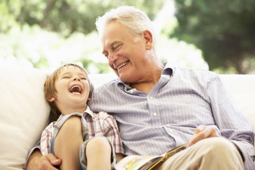 Grandfather laughing with grandson